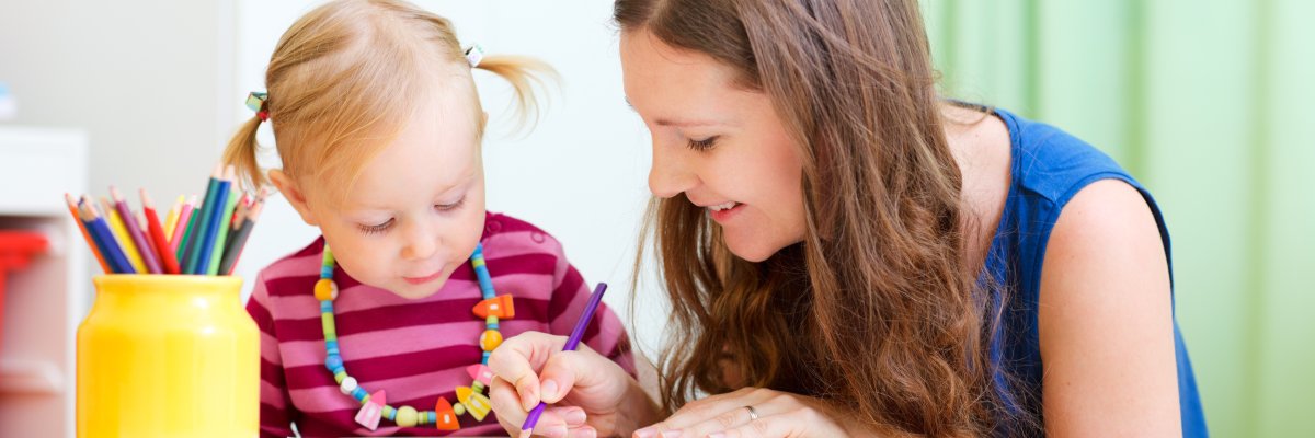 Mother and daughter drawing together