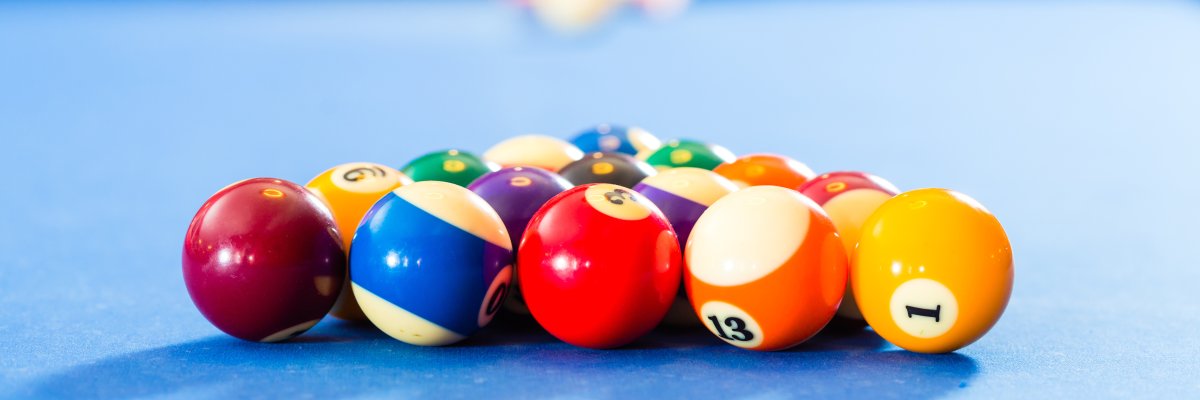People playing pool billiard game