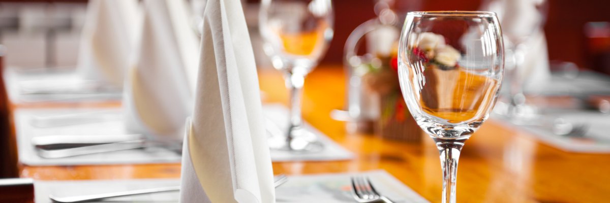 Glasses and plates on table in restaurant Glasses and plates on table in restaurant