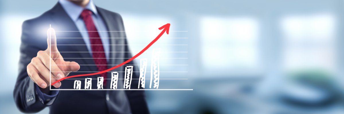 Man in office with chart Man in office with chart